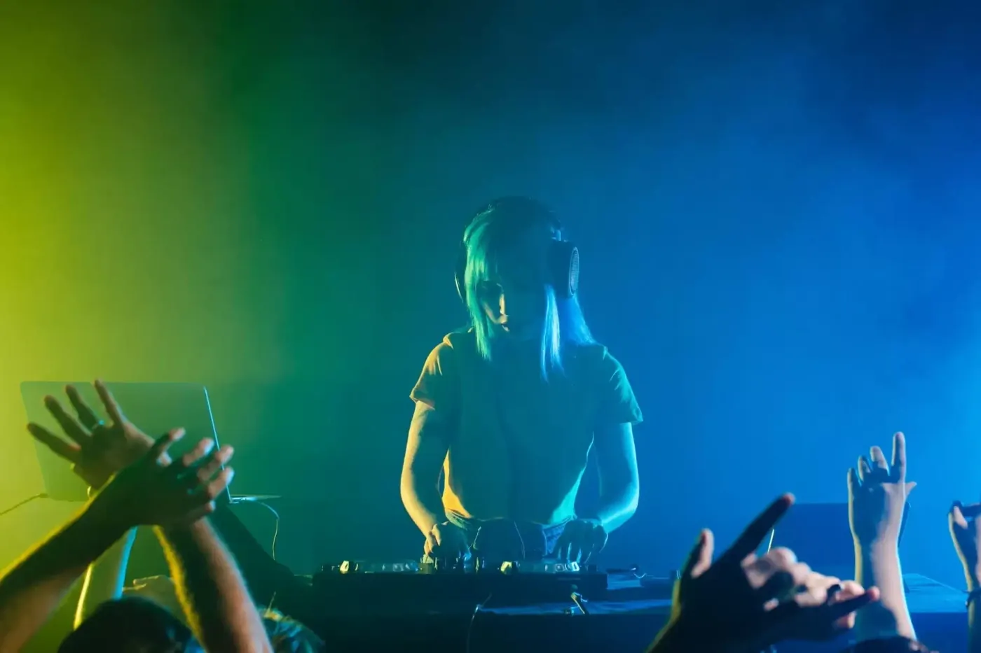 DJ set under blue and green light at Rico Latino, the single-room Latin club near Leidseplein in Amsterdam