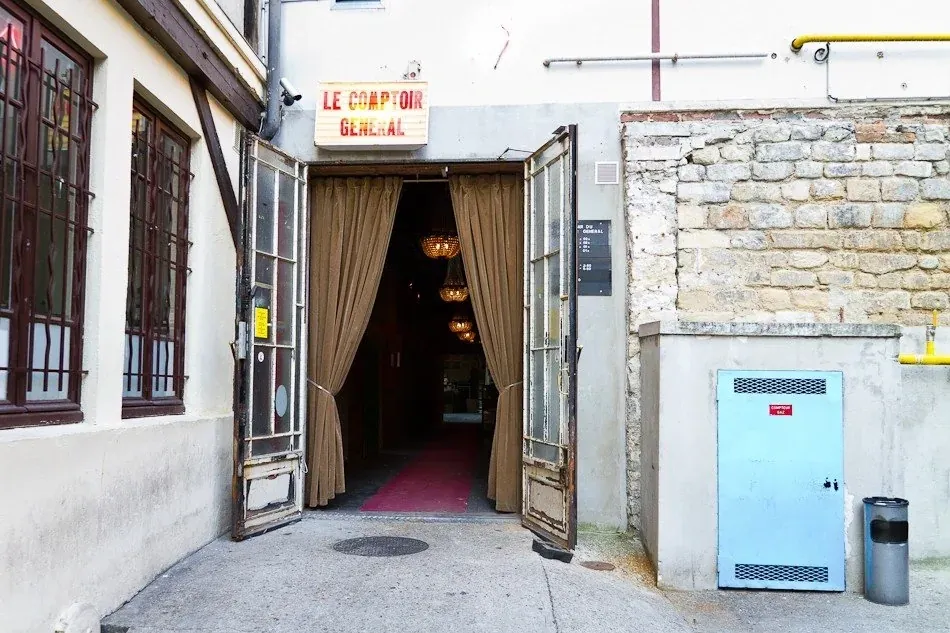 The curtained courtyard entrance of Le Comptoir Général on the Canal Saint-Martin, host of the free alternating Wednesday Latin night