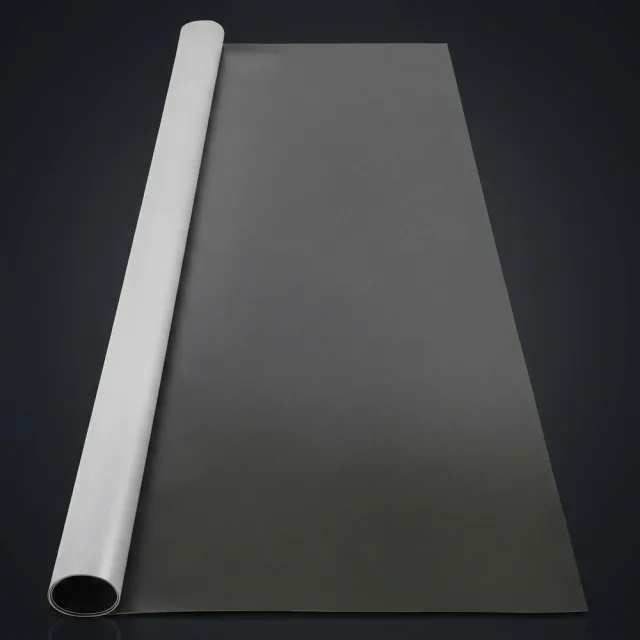 Partially unrolled VEVOR vinyl dance floor roll with dark grey matte surface against a dark studio backdrop